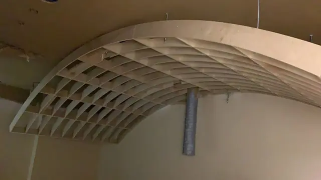 Barrel-vault ceiling framing with curved wood ribs