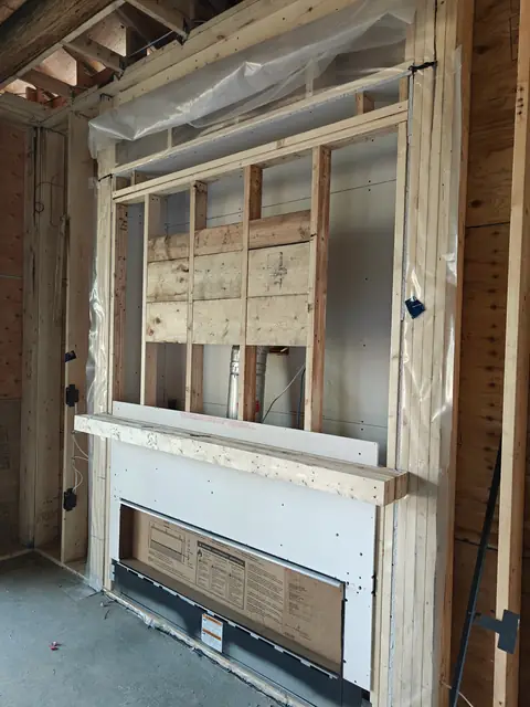 Framed fireplace surround with mantel blocking