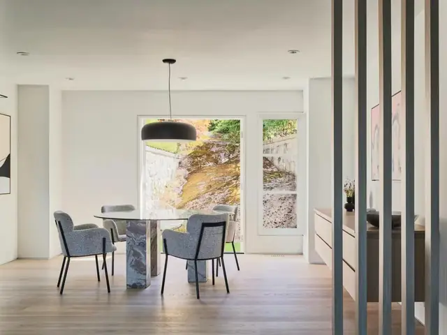 Dining nook with a slatted wood room divider