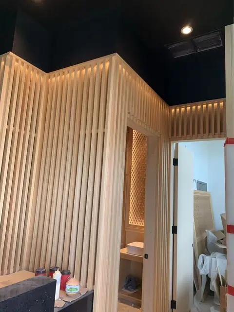 Vertical timber slat walls with integrated LED lighting