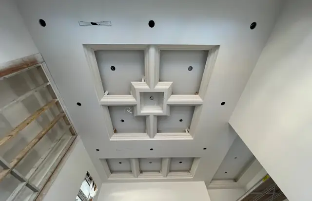 Coffered ceiling with layered geometric trim detail