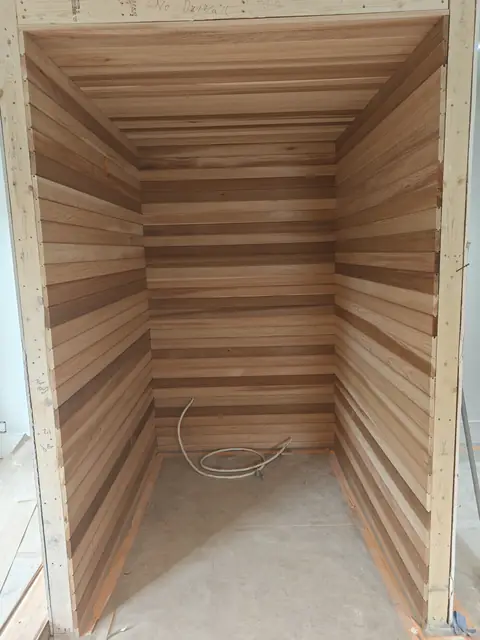 Cedar-lined closet with tongue-and-groove panelling