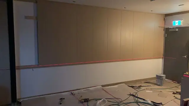 Commercial interior with full-height wood veneer wall panels