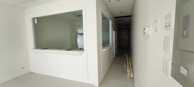 Office renovation with framed interior window and finished drywall