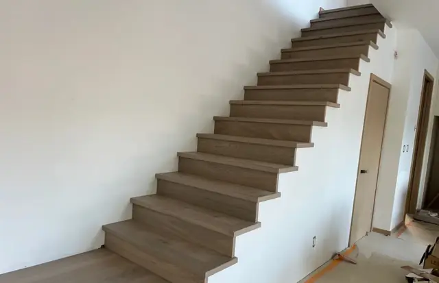 Hardwood staircase with matching nosing in a new home