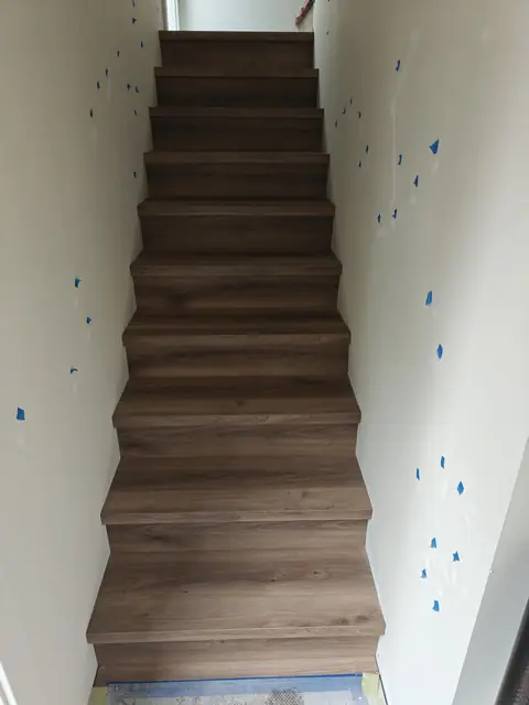 Dark engineered hardwood staircase finish